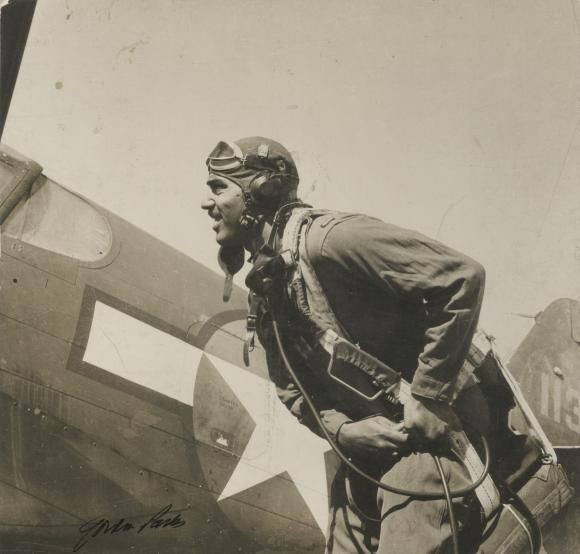 A man standing near a plane